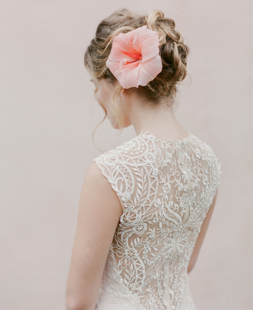 Enchanting by Mon Cheri’s 116128 chiffon gown with embroidered  illusion back from Palmetto Bridal Boutique. Amaryllis from Gathering Floral + Event Design.