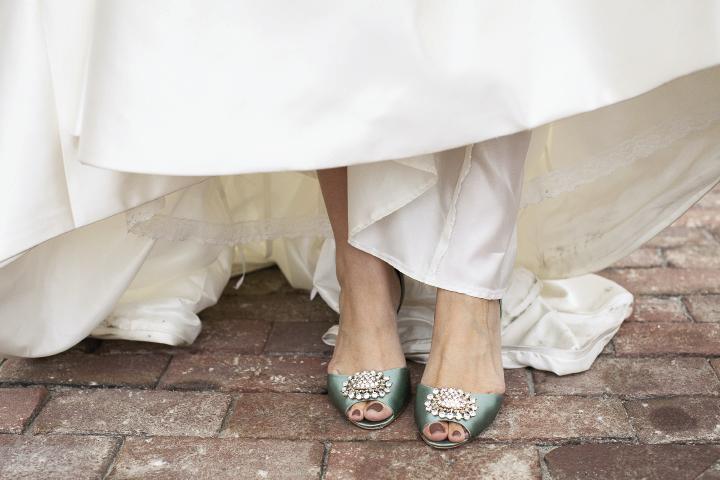 TWINKLE TOES: The reception’s mint green theme popped up on Brianna’s Badgley Mischka heels.