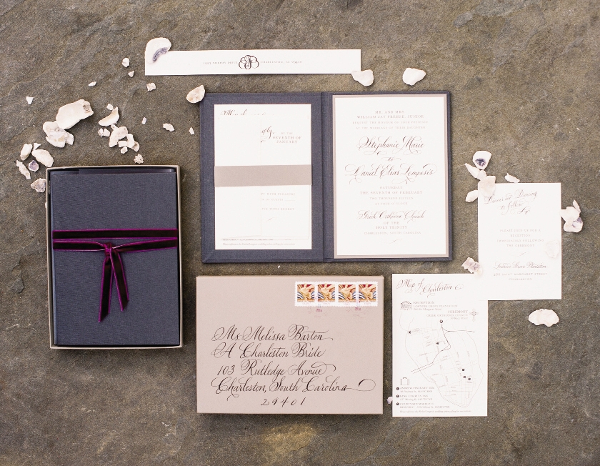 Invitations, hand-delivered to each guest, were tied with velvet ribbon in  a rich shade of Bordeaux.  Stationery by Studio R Design. Calligraphy by Elizabeth Porcher Jones. Image by Timwill Photography.