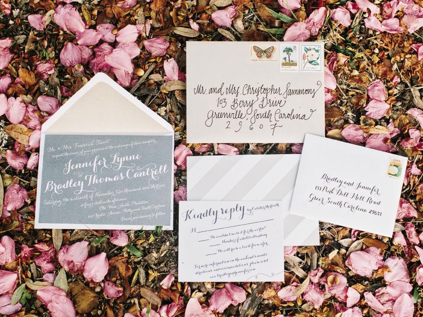 Jennifer played with orientation and contrast in the printed materials she drafted on  Wedding Paper Divas and printed with Vistaprint. Vintage stamps procured on eBay and envelopes addressed by a calligrapher finished the look.