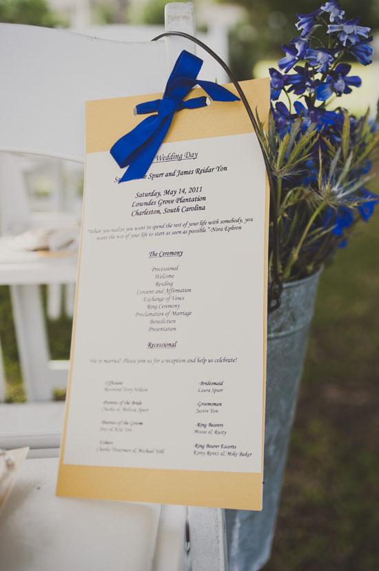 DIY TIME: With the help of a few friends, Sarah made the one-sided programs by hand, then tied them to guests’ seats with thick ribbons in a shade matching the adjacent delphinium and hydrangea blooms.