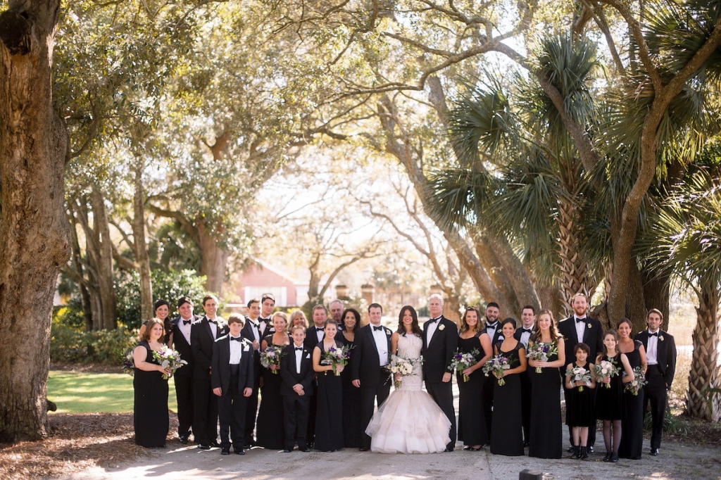 Bride&#039;s gown by Lazaro (available locally at Gown Boutique of Charleston). Bridesmaids&#039; dresses by Ralph Lauren. Menswear by Jos. A. Bank. Florals by Stems Floral Design by Jonie Larosee. Image by Timwill Photography at Lowndes Grove Plantation.