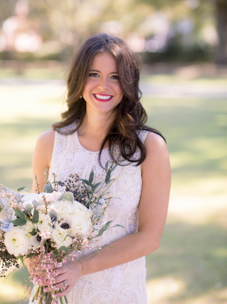 Bride&#039;s gown by Lazaro (available locally at Gown Boutique of Charleston). Hair by Updo Charleston. Makeup by MakeUp. Florals by Stems Floral Design by Jonie Larosee. Image by Timwill Photography.