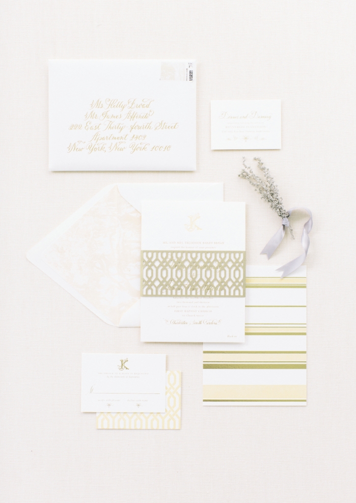 Lettered Olive fashioned a stationery suite in peaches, creams, and pale green to complement the reception landscape and wedding florals. A standout? The laser-cut belly band on the invitation.