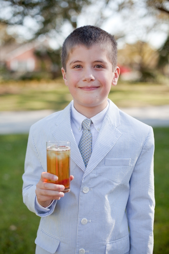 LOWCOUNTRY LAD: Complete with a seersucker suit and glass of sweet tea, a young guest shows off his Charleston charm.