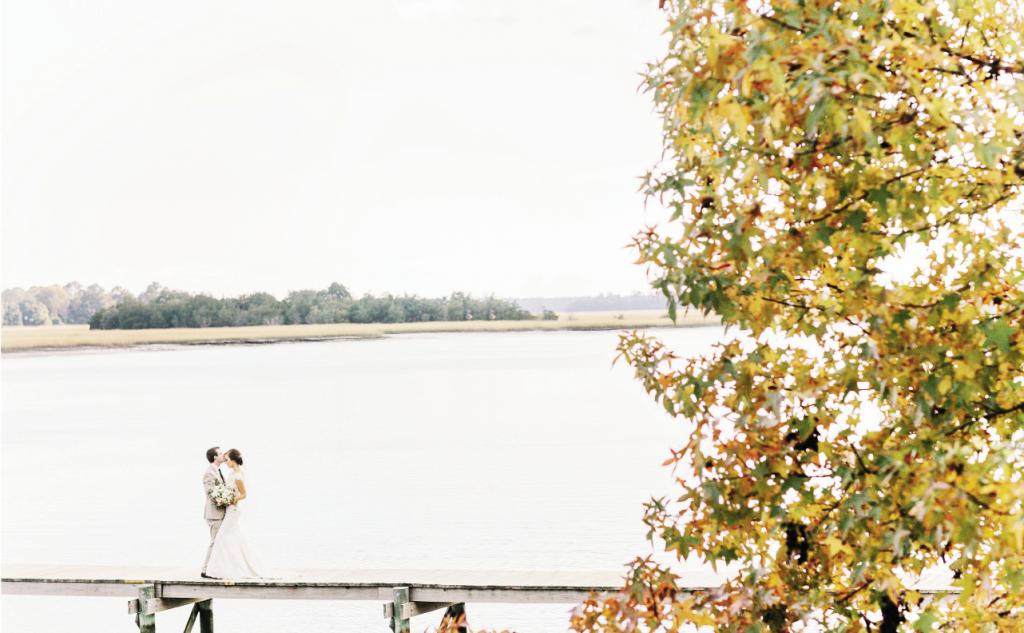 Located about half an hour south of Charleston in Hollywood, South Carolina, Old Wide Awake Plantation sits nestled on the Stono River. Jennifer and Bradley met on its private dock  for their pre-ceremony first look and portrait.