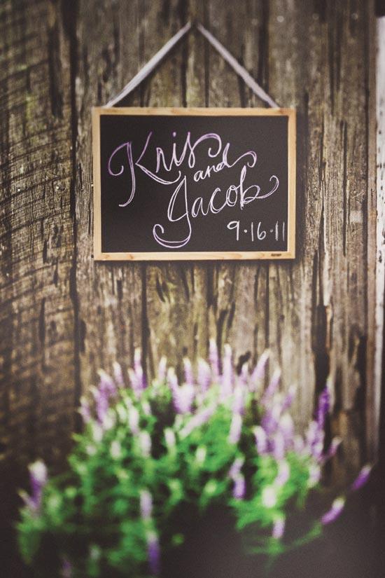SIGN OF THE TIMES: The chalk for the handmade reception sign showcased the lilac and plum palette.