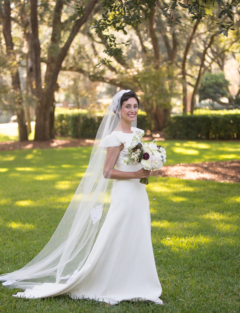 Bride&#039;s gown by Delphine Manivet. Florals by Charleston Stems. Photograph by Captured by Kate.