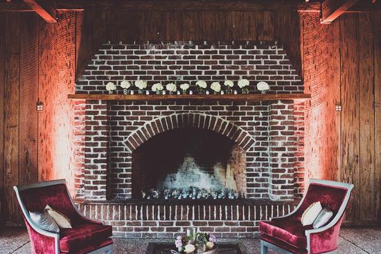 HOME IS WHERE THE HEARTH IS: Votive candles filled the fireplace and, alternating with hydrangea-filled vases, dressed the mantle, as well.