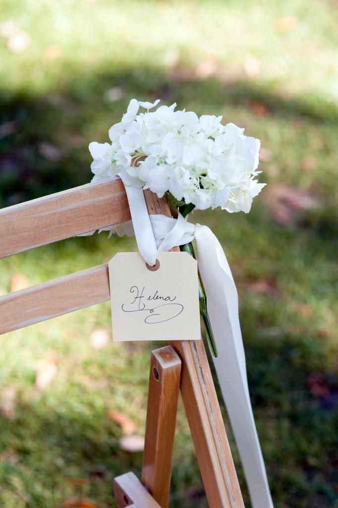 SAVE MY SEAT: Event designer Luke Wilson used silk ribbon to secure hydrangea bunches and nametags to ceremony chairs.