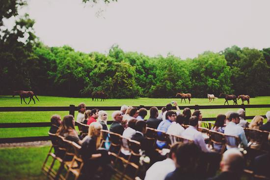 PASTORAL SETTING: Framed by the colorful green pastures of Boone Hall and some horses trotting by, the outdoor ceremony was one with nature.