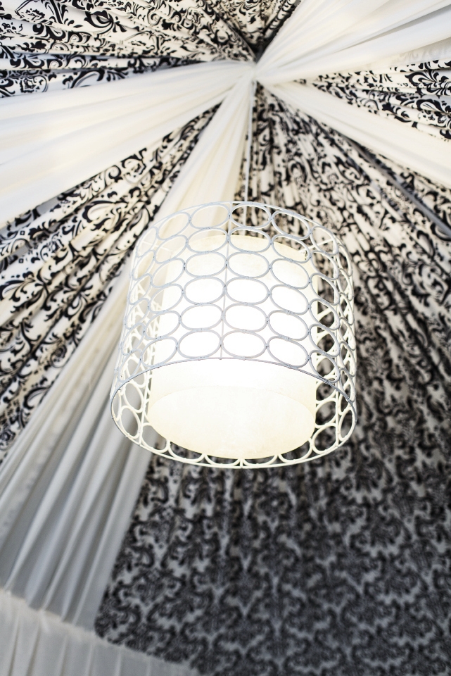 LIGHT IT UP: A mod light fixture brightened the tent with its ruched ceiling fashioned from patterned fabric.