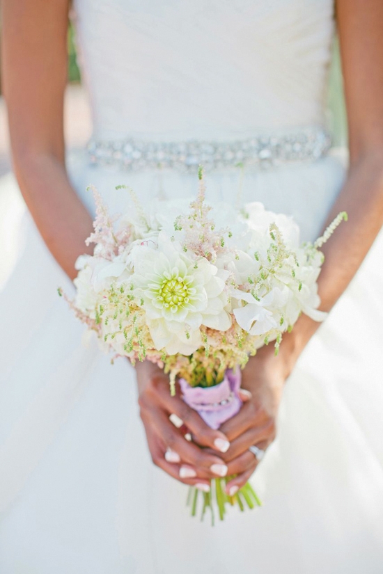PERFECT PICK: The bride carried a bouquet of white peonies, pink and white astilbe, while dahlias, and sweet pea from Tiger Lily Florist.