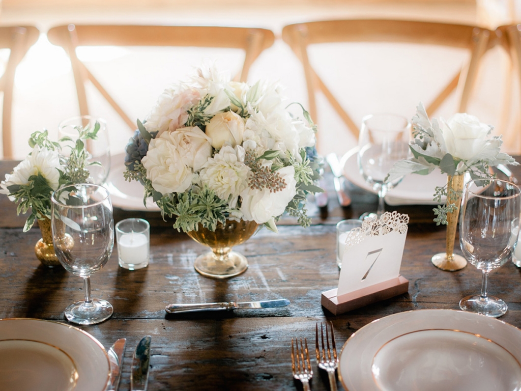 Wedding design and rentals by Ooh! Events. Table numbers from BHLDN. Florals by Out of the Garden. Image by Brandon Lata Photography.