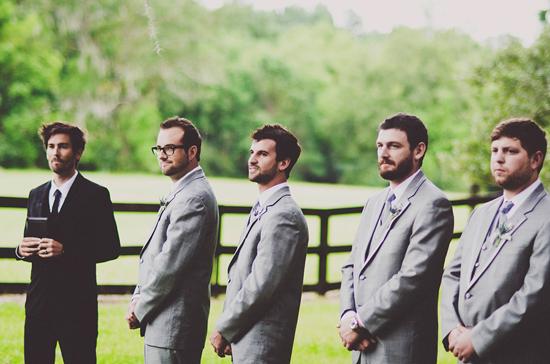SUPPORTING CAST: The groomsmen awaited Kristin’s arrival down the aisle in charcoal-colored J.Crew tuxes.