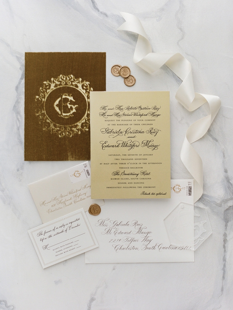 Embossed with the couple’s ornate crest, Lettered Olive’s stationery suite set the gilded tone for a night to be remembered.  &lt;i&gt;Photograph by Corbin Gurkin&lt;/i&gt;