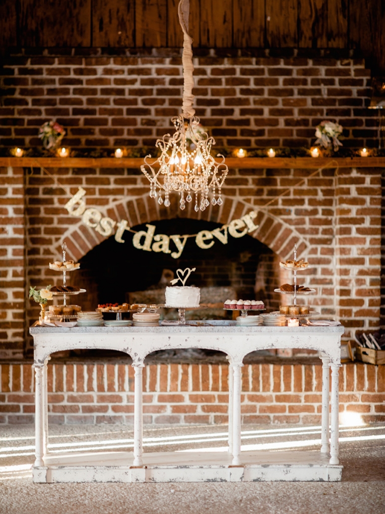 Signage and cake topper from BHLDN. Wedding design and rentals by Ooh! Events. Sweets by WildFlour Pastry. Image by Brandon Lata Photography at Boone Hall Plantation and Cotton Dock.