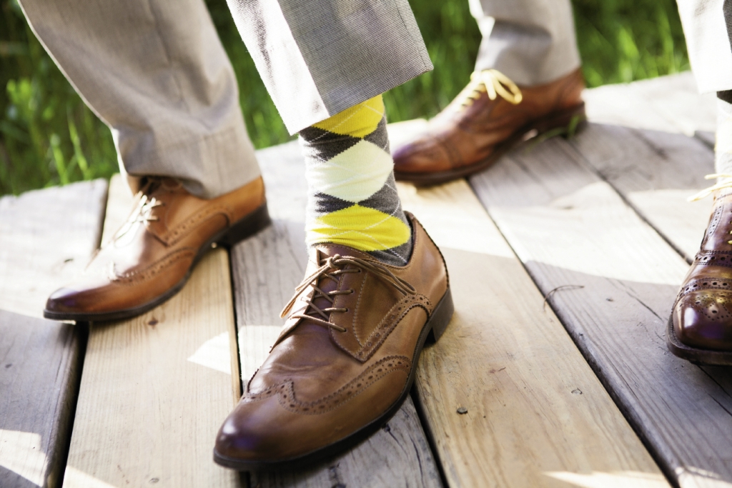 MELLOW YELLOW: Michael and his groomsmen wore argyle socks in the day’s palette of lemon yellow and gray.