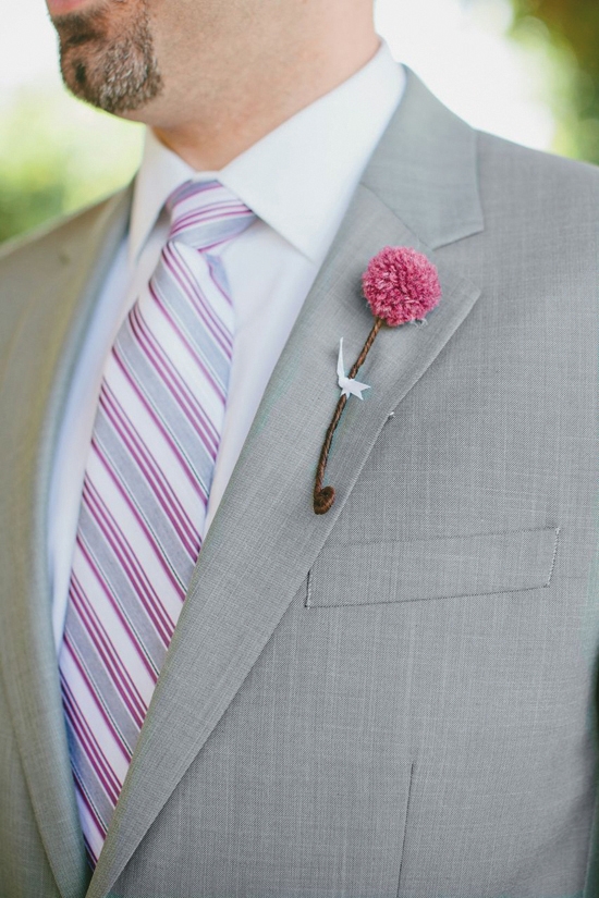 DELICATE DETAIL: Groomsmen wore small berry colored yarn pom pom boutonnieres made by Heather Carr with “stems” of floral tape tied with a tiny bit of ribbon.
