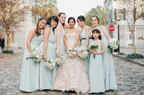MY GIRLS: Bridesmaids wore pale blue-green Bari Jay gowns in the same sweet colors as the receptions&#039; paper flowers.