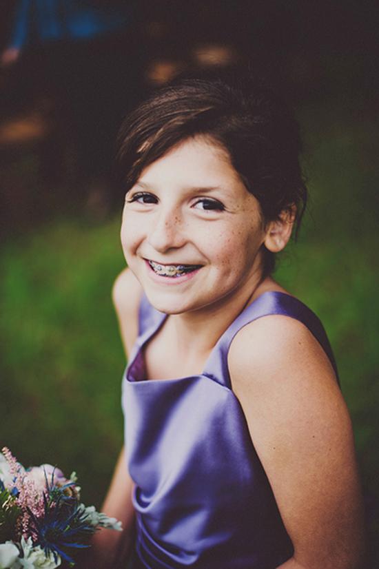 SMILING PRETTY: Junior bridesmaid Lucy, Kris’ youngest sister, glowed in a purple satin shift.