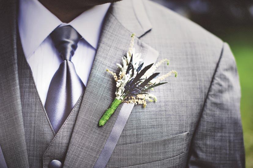 THE PERFECT TOUCH: Jacob’s simple thistle and astilbe boutonniere accented his charcoal J.Crew tux.