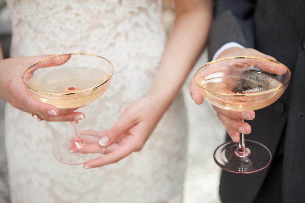 RICH IN LOVE: The couple celebrated with etched champagne coupes—a shape originally designed for English aristocrats.