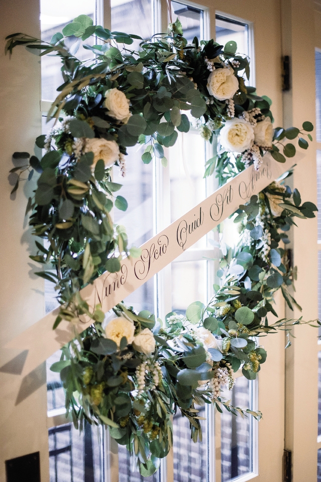Wreath and sign by Bon Vivant. Image by Timwill Photography at McCrady&#039;s Restaurant.