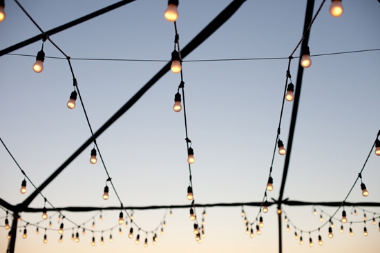 GARLAND GLITTER: Technical Event Company draped strands of globe lights across a tent frame to create a outdoor room.