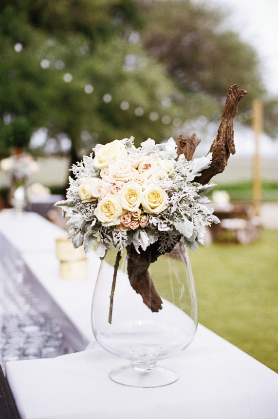 HB Stems married fresh blooms with driftwood pieces; displaying them in glass took the look from rustic to sophisticated.