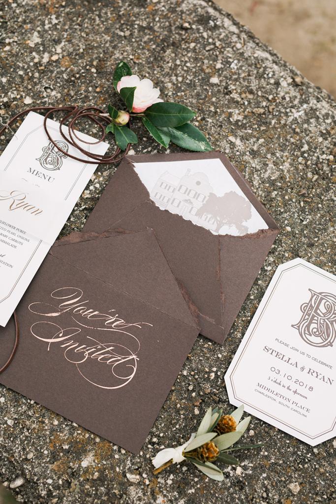 Another perk of a shorter guest list? Custom calligraphy becomes an option for even modest budgets. Here, copper foil ink marks handmade envelopes.