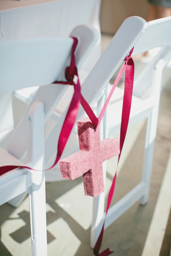 ARTS &amp; CRAFTS: “I wanted my wedding to be clean and fresh, with lots of detailed touches,” says the bride. Wedding designer Heather Carr personalized the space with DIY décor, like these berry-colored plus signs made of yarn, cardboard, newspaper, and tape.