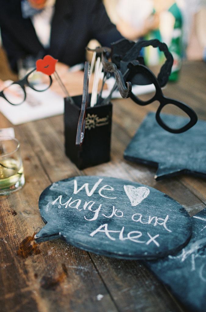 TAKING NAMES: Guests posed with props like novelty glasses and chalkboard conversation bubbles and had their pictures made.
