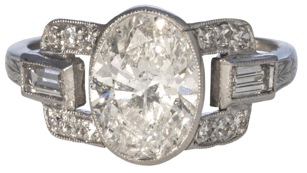 Art Deco 1.66 ct. oval diamond ring with baguette-cut (.29 total cts.) and single-cut (.18 total cts.) diamonds in 14K white gold from Croghan’s Jewel Box ($11,500)