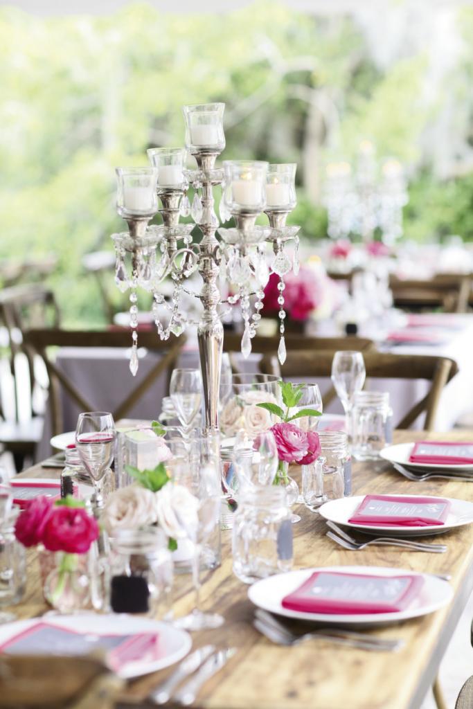 TABLE TIME: Mason jars joined candelabras on tables. “Combined with the gorgeous flowers that ranged from white to bright pink, the mix was formal but at the same time, relaxed,” Michelle says.