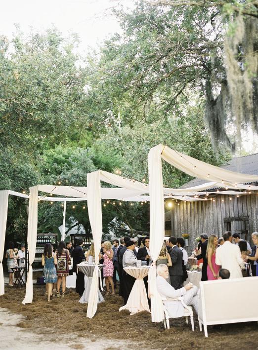 GARDEN PARTY: Swaths of hung fabric defined the open-air cocktail area.