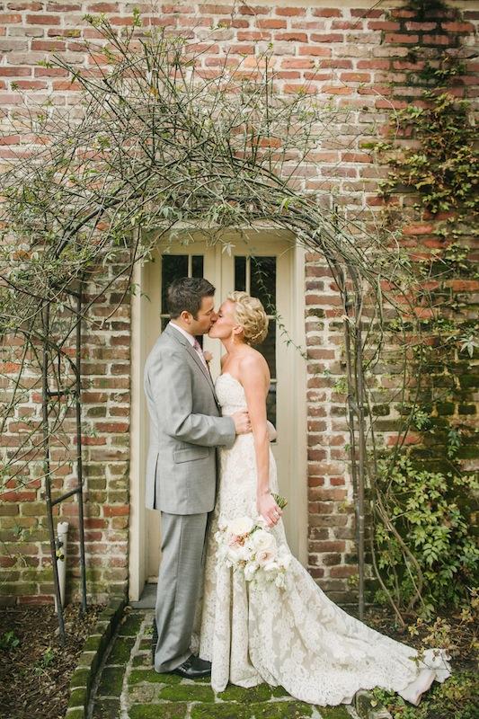 Bridal gown by Anne Barge from Fabulous Frocks. Groom’s suit by Jos. A. Bank. Bouquet by Branch Design Studio. Image by Juliet Elizabeth Photography at the Confederate Home and College.