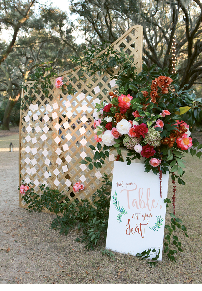 A pair of simple wooden lattices, painted a shimmering gold and placed  at the entrance to the reception, formed a place card station.   &lt;i&gt;Photograph Jennifer Bearden&lt;/i&gt;