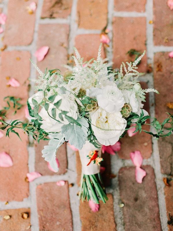 Whitney Randall of Branch Design Studio made a feminine bouquet of astilbe, anemones, garden roses, ranunculus, and scabiosa pods mixed with dusty miller and jasmine vine.