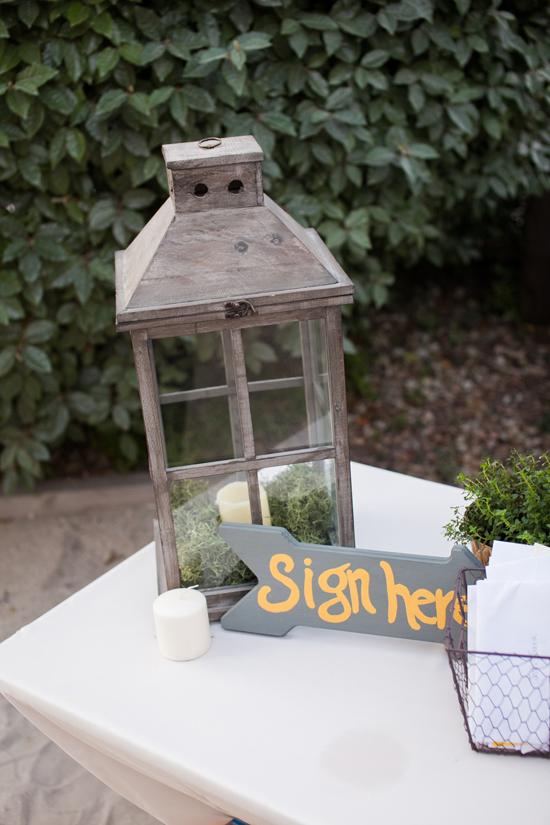 FOLLOW DIRECTIONS: Roughly 90 percent of the wedding was crafted by Sara, Josh, and their friends and family, including signs like this one.