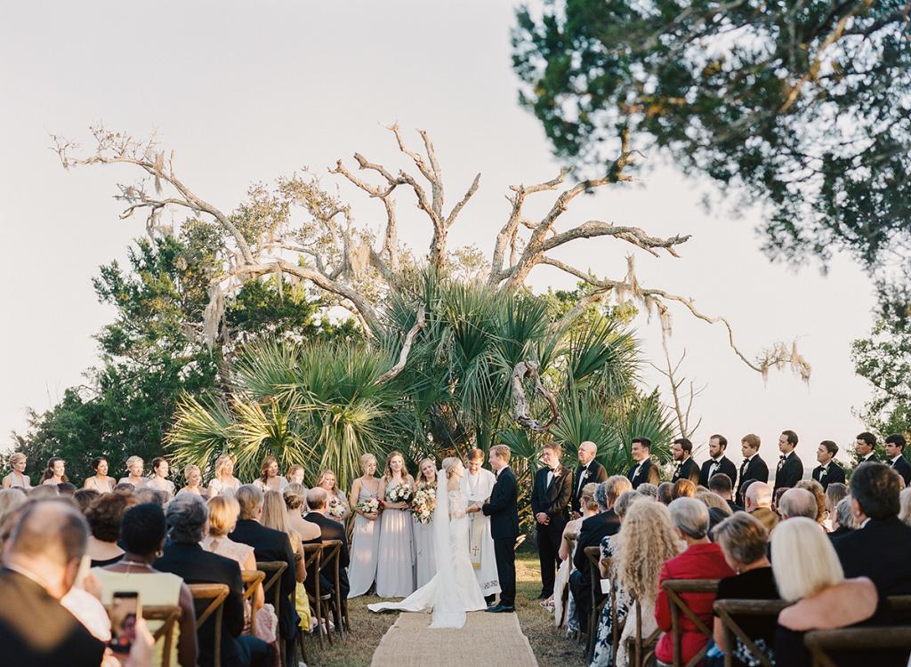 Anna says her wedding designer Blake was “the planning genius” who found a location for their vows that met all the couple’s requirements: amazing views of the Wadmalaw marsh; room for hundreds of guests; and high ground that wouldn’t flood, even though the fading day saw a full moon and flood tide.