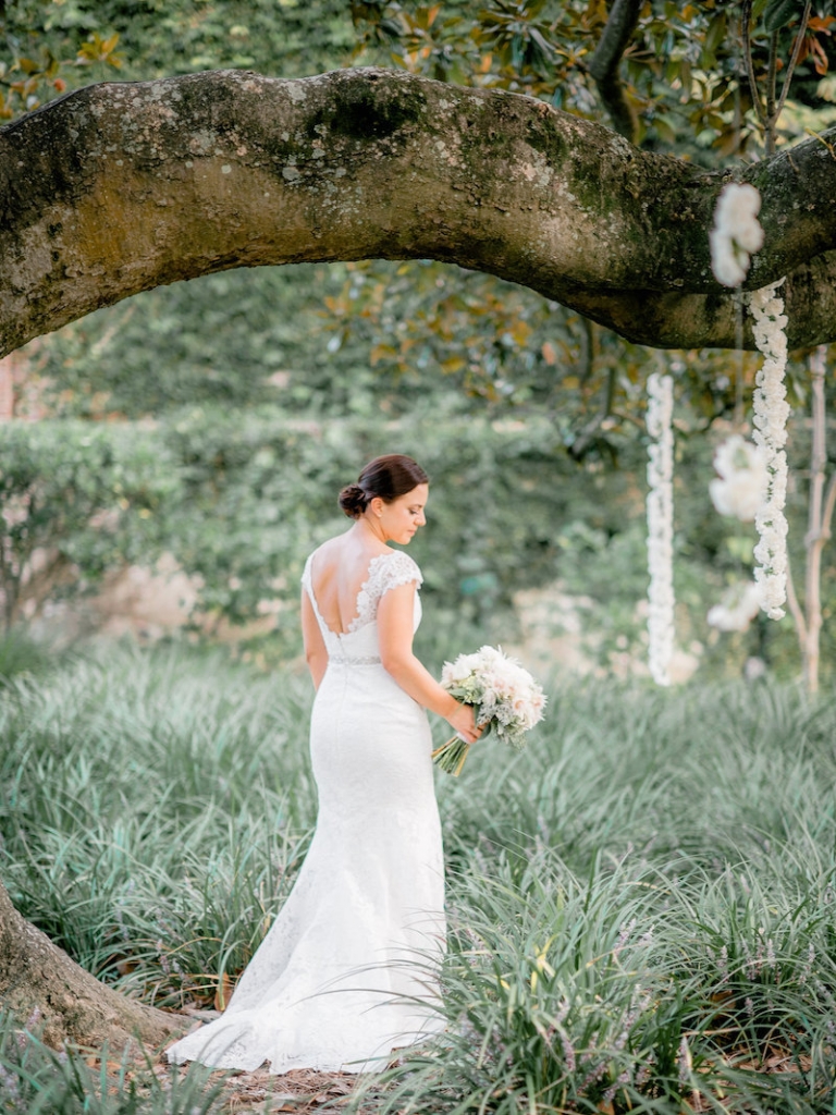 Florals by Out of the Garden. Bride&#039;s gown by Romona Keveza, available in Charleston through Maddison Row. Photograph by Brandon Lata at the William Aiken House.