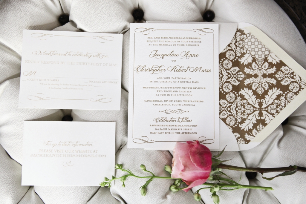A HANDSOME HELLO: Invitations picked up on the scrolls of reception china.
