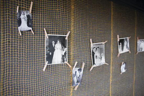 PINTEREST: Sara and Josh clothes-pinned family photos on netting they hung on the walls of the picnic shelter where they hosted a reception.