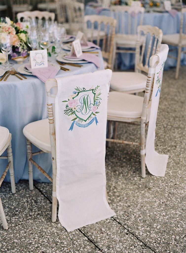 “People forget how much can be digitized these days,” says Calder, explaining you can purchase chair adornments like these online, and take them, along with a scan of your wedding crest or monogram, to a local screen printer.