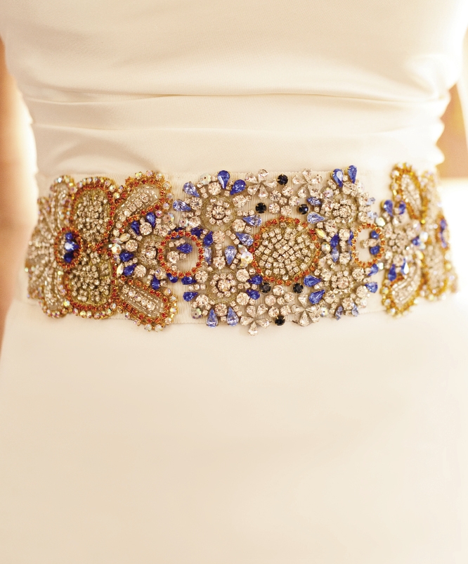 CROWN JEWELS: Jessica says she wanted to “add a little color and some spunk” to her ensemble, so she commissioned a handcrafted,  bejeweled sash from the Etsy shop Doloris Petunia to accent  her Vera Wang gown.