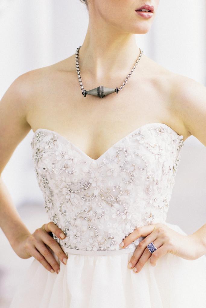 UP CLOSE &amp; PERSONAL: Jim Hjelm’s organza gown with embroidered and  beaded bodice from Gown Boutique of Charleston. Silver  Turkish necklace from Dixie Dunbar Studio. 18K white gold ring with sapphires and  diamonds from Croghan’s Jewel Box.