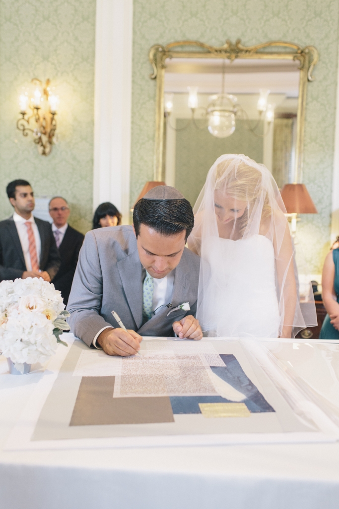 ON THE DOTTED LINE: In keeping with Jewish tradition, Ezra signed a ketubah (or marriage contract) prior to the ceremony, signifying his promise to provide for his bride-to-be.