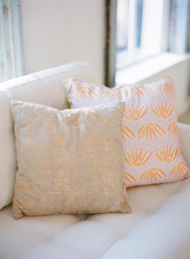 GET COZY: Pillows donned cheery fabrics designed by Lulie Wallace and added comfort to seats throughout the LulaKate atelier.