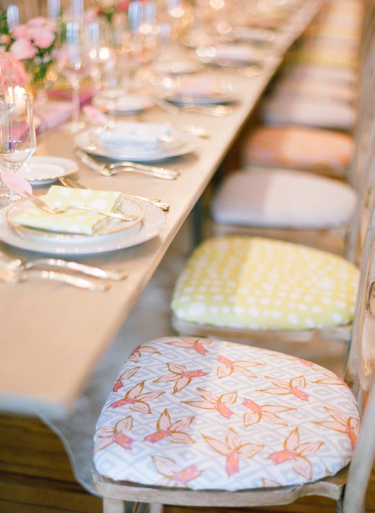 RAINBOW SET: Covering chair seats in a selection of fabrics added depth to the décor.